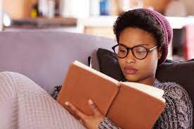 black woman reading a book